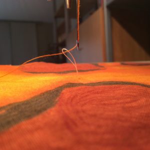 sewing on a button