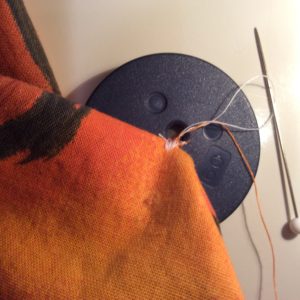 sewing on button by machine
